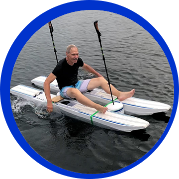 A man is sitting on the back of a kayak